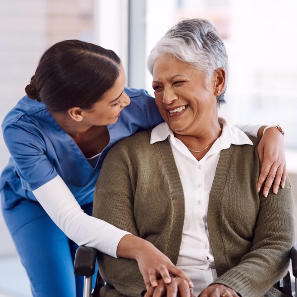 Nurse supporting an older patient